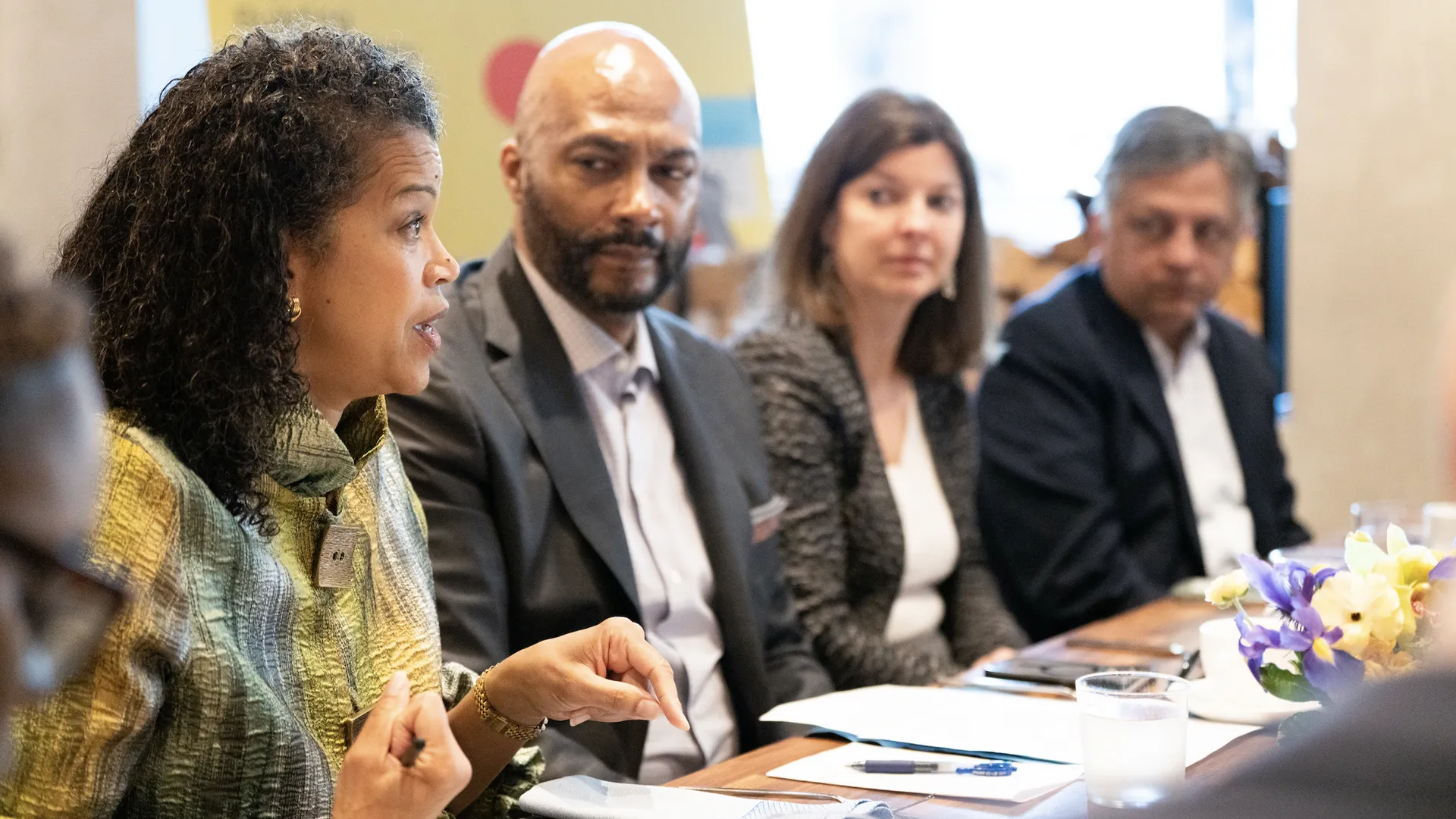 Dr. Shairi Turner speaking at a roundtable discussion with fellow panelists